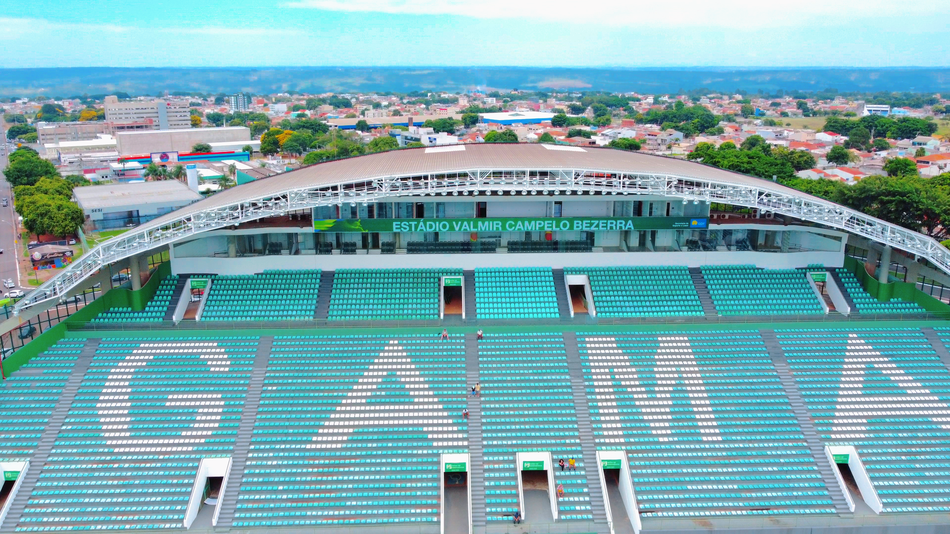 Drone shot of Estádio Valmir Campelo Bezerra in Brasília, showcasing a vivid urban landscape. — Julius Caesar The Man Who Cha